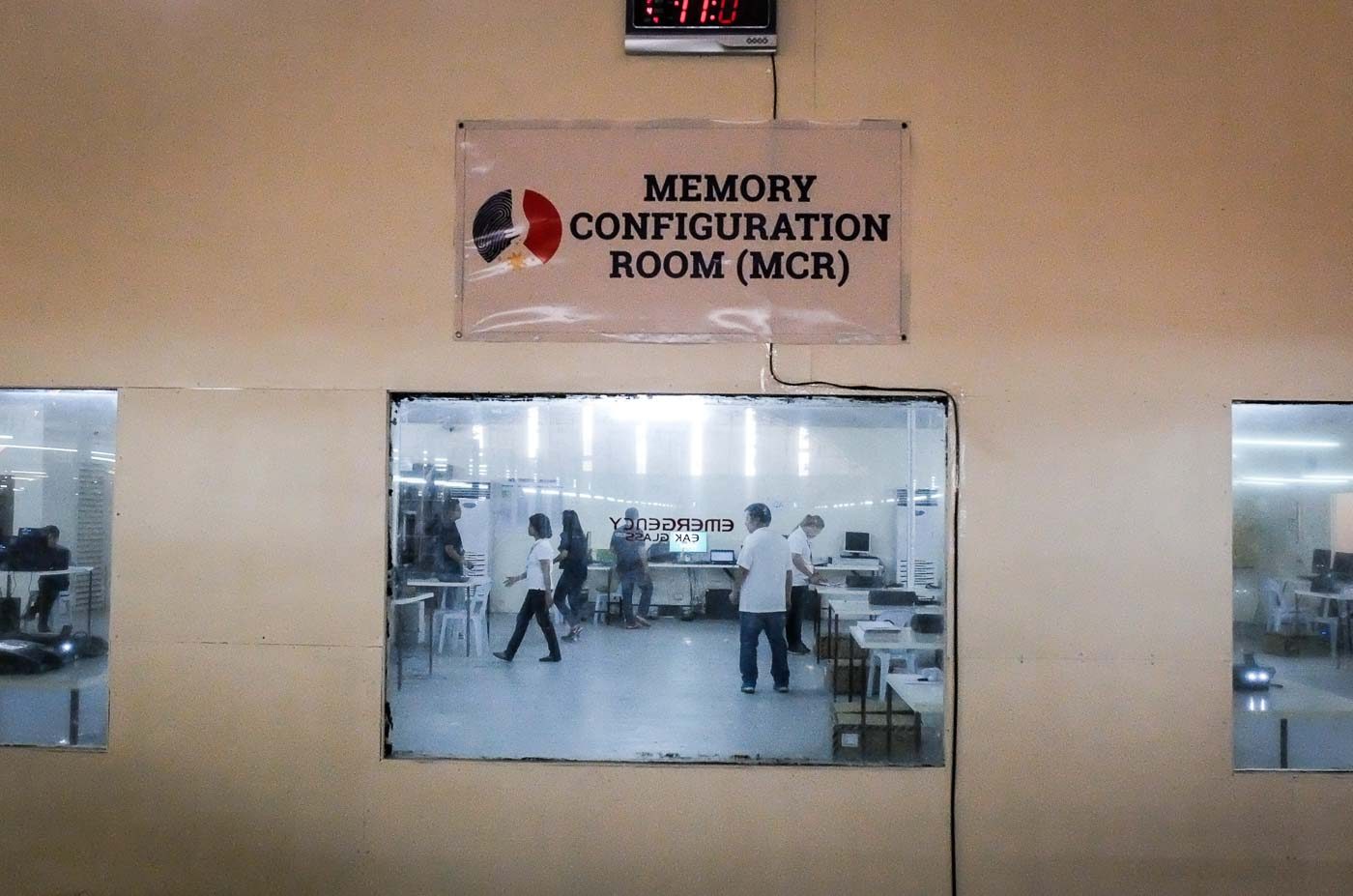 The Memory Configuration Room, found inside the main production facility, is only accessible to a limited number of Comelec and Smartmatic employees. The room houses the election management system, which loads election-related data to prepare the ballot faces and creates configuration files for the VCMs. 