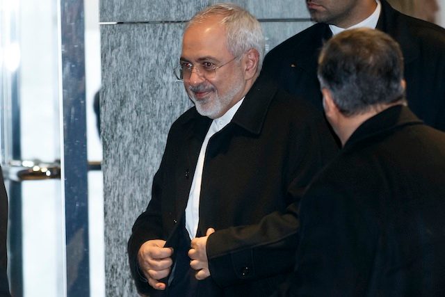ALL SMILES. Iranian Foreign Minister Mohammad Javad Zarif leaves the hotel, following a bilateral meeting with US Secretary of State John Kerry (not pictured) for a new round of nuclear talks, in Geneva, Switzerland, 23 February 2015. Salvatore di Nolfi/EPA 
