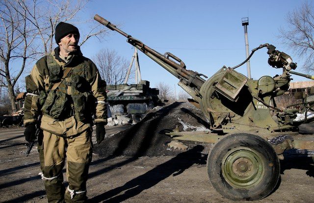 Arms pullback accord, prisoner swap bolster shaky Ukraine truce