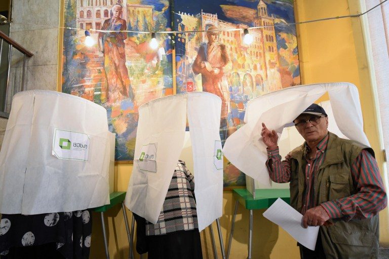 Ruling party wins Georgia vote, opposition alleges fraud