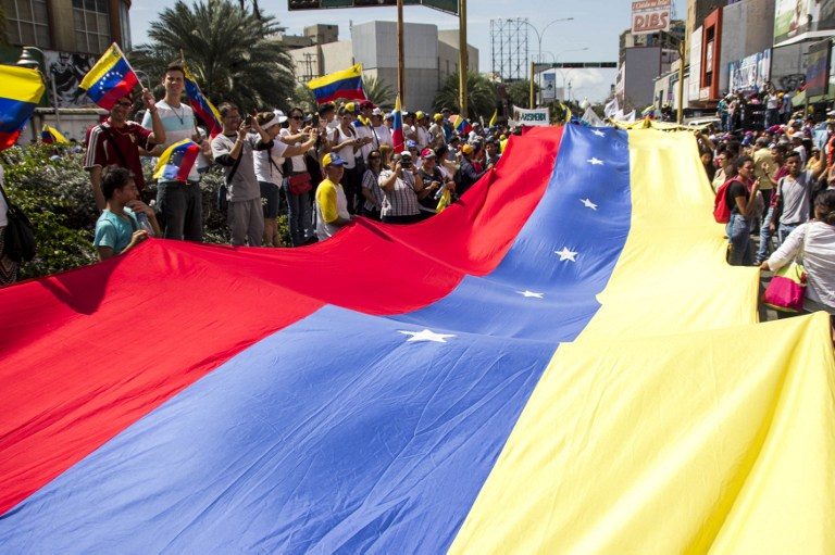 Venezuela protests, strike threat raise heat on Maduro
