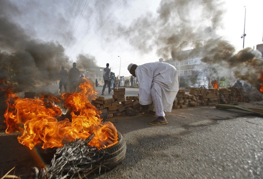 13 dead as Sudan military rulers break up sit-in