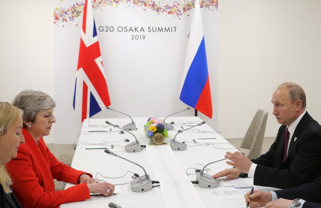 May to Putin: Stop ‘destabilizing’ UK, allies