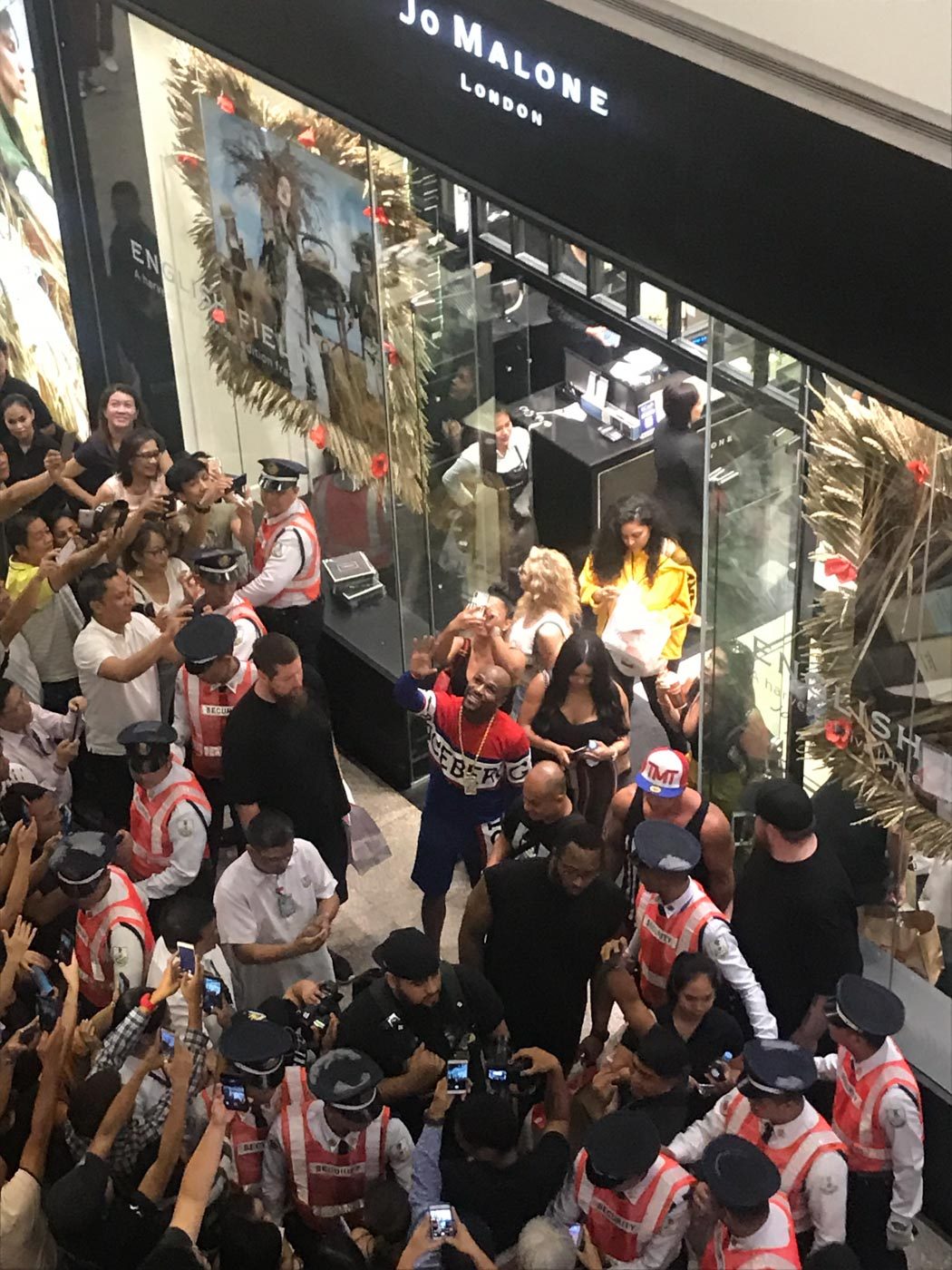 MOBBED. Mayweather gets a lot of lovin' from Filipino fans. Photo by Miguel Murga   