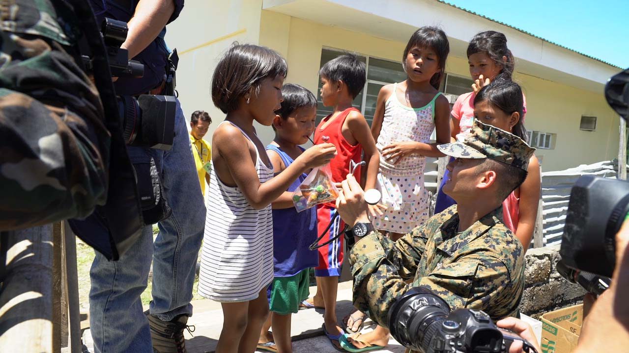 EDUCATION TOO. A US Navy man teaches Casiguran children how to use a stethoscope. Photo by Jeff Digma/Rappler 
