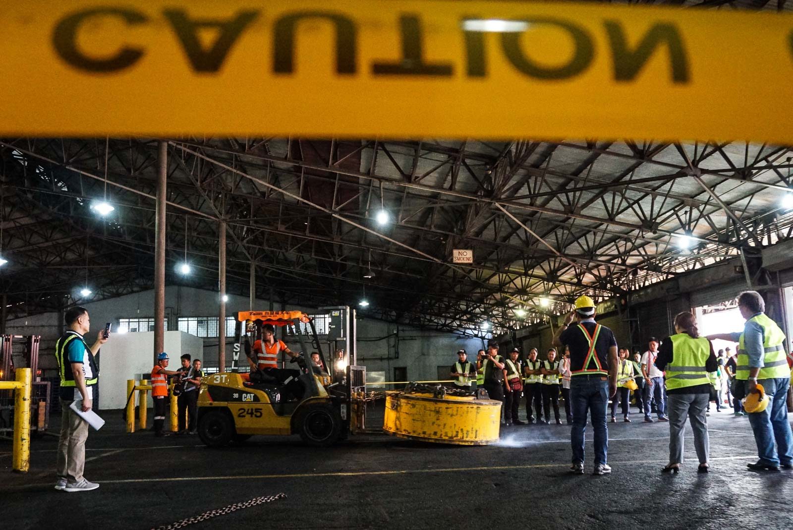 INVESTIGATION. Members of the Department of Justice investigation panel on March 8, 2019, inspect the magnetic lifters involved in the drug smuggling at the Bureau of Customs at the Manila International Container Port. Photo by Lito Borras/Rappler  