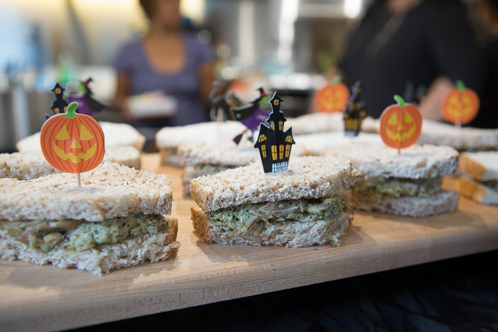 JAZZ IT UP. Simple themed Halloween picks carefully placed in creamy chicken pesto salad add a bit of whimsy to these dreary coffins. Photo by Jay Santos 