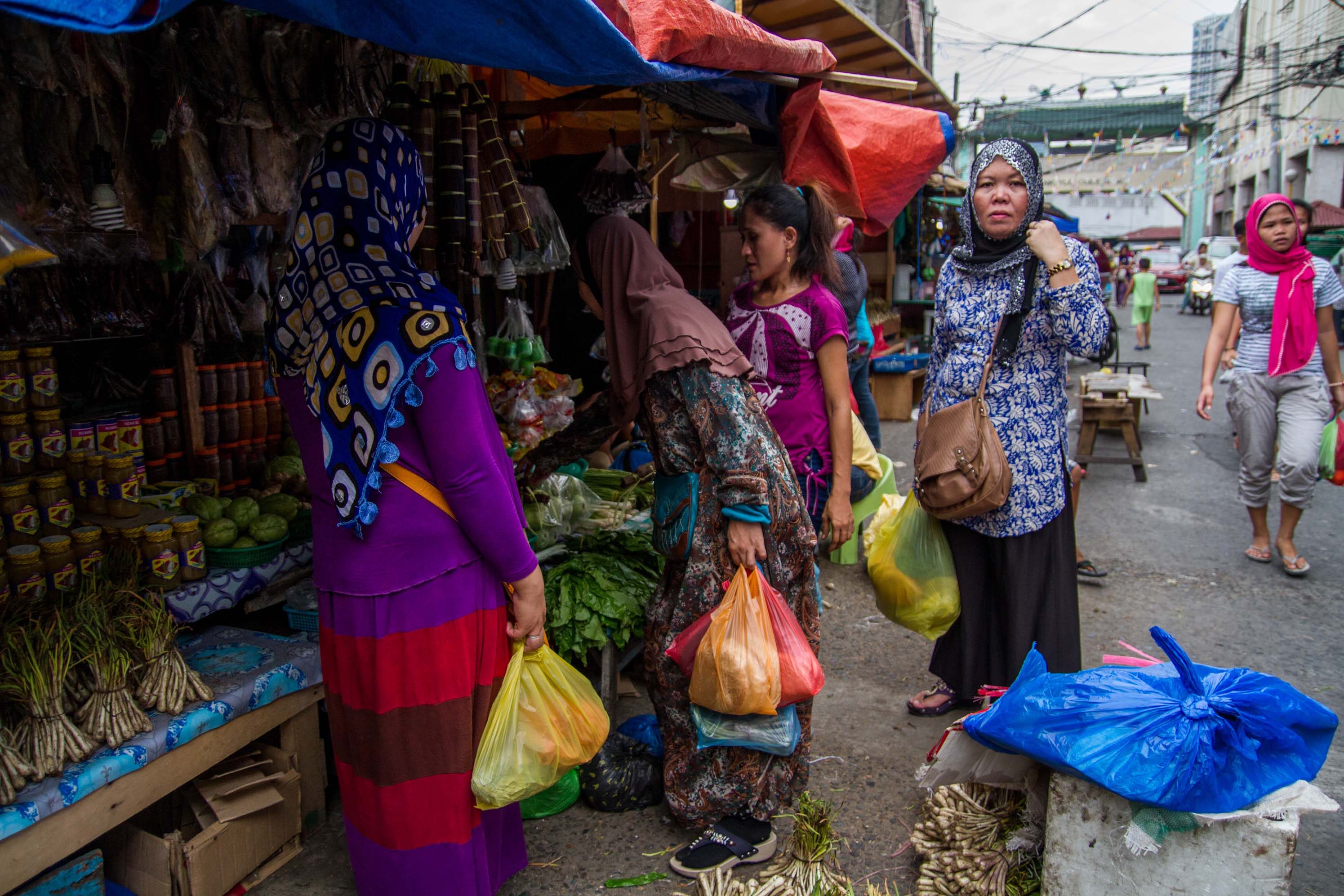 AFTER 6PM. Muslim women buy food to be served after 6 in the evening, the time they are allowed to eat during Ramadan.  