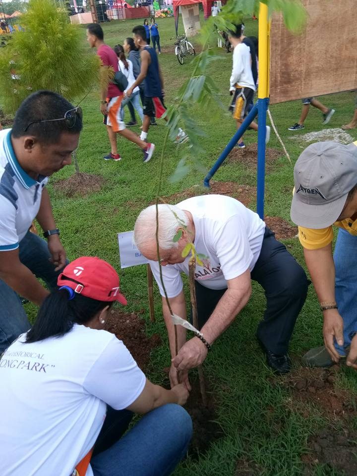 TREE PLANTING. Mayor Lucilo Bayron leads the mass planting of Balayong trees in Puerto Princesa City. Photo courtesy of Cheradee Lestino/City Information Office 