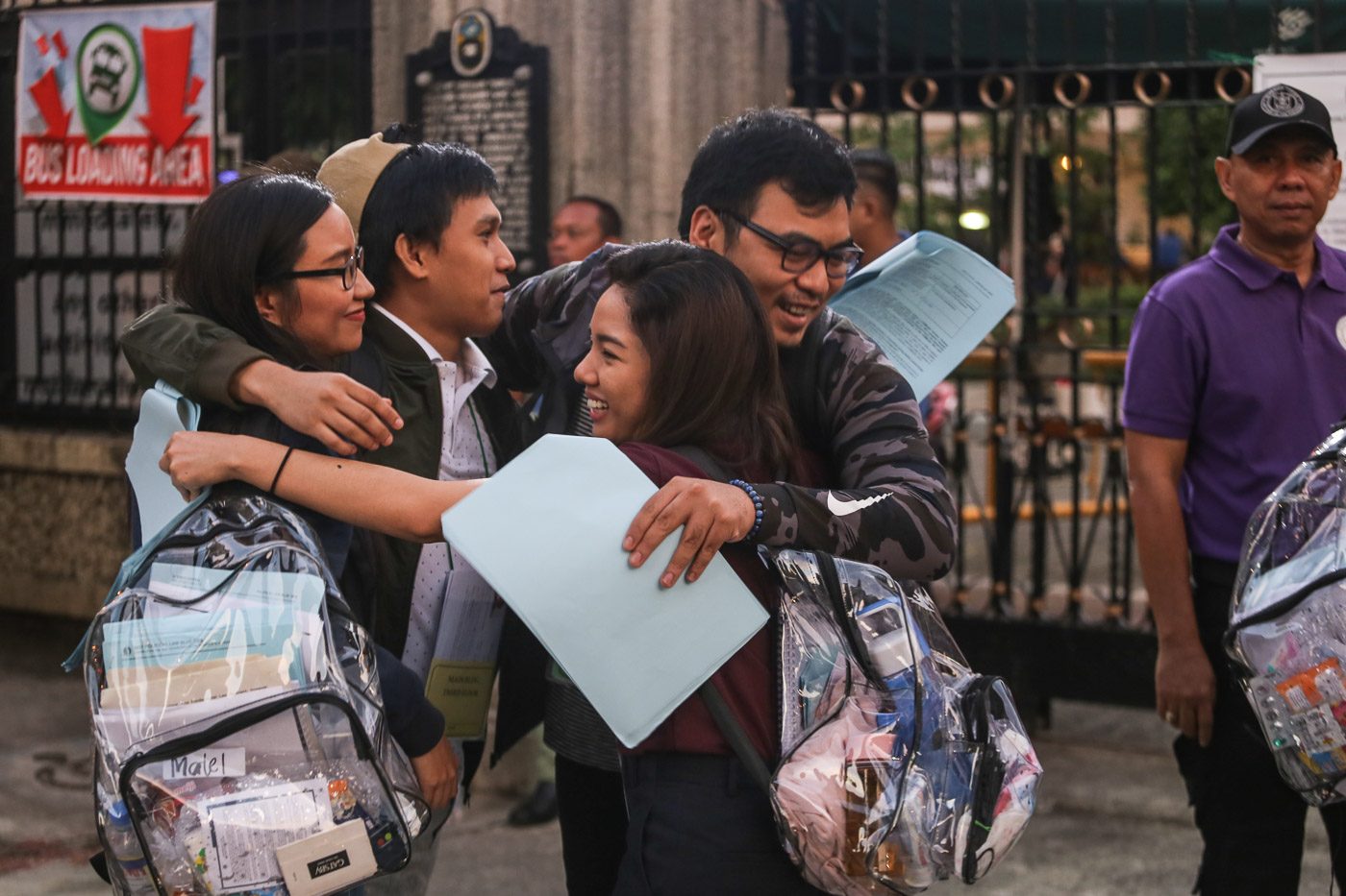 GOOD LUCK. Bar candidates hug each other before entering the campus for the exams.   