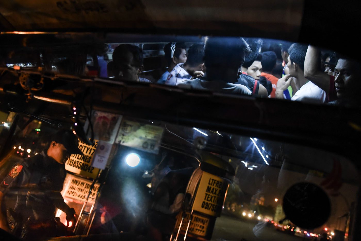 JAMPACKED. More than 20 individuals ride a jeepney meant for only 14 passengers. 