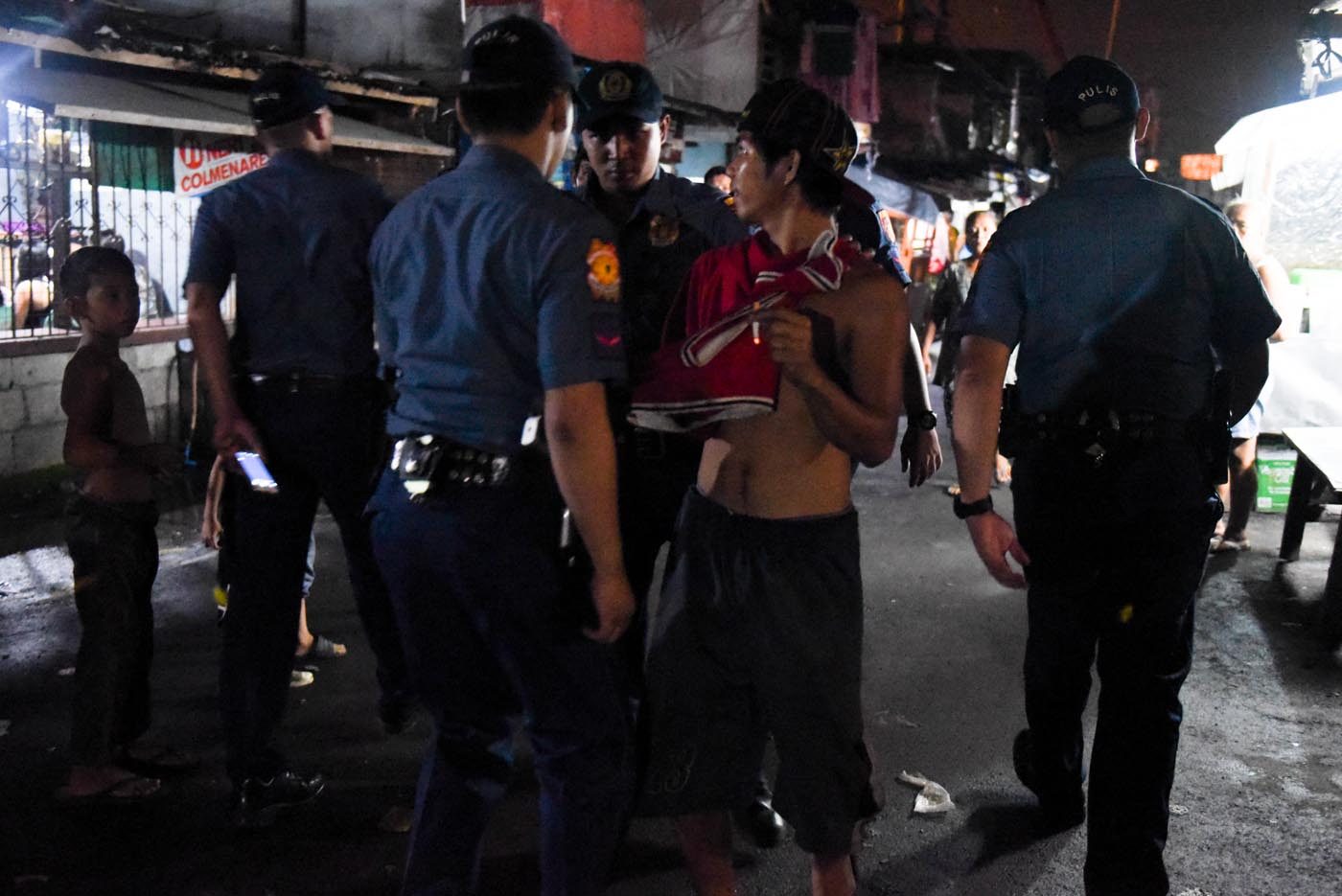 NOT ALL ARE DRUG SUSPECTS. Bystanders and shirtless men are 'invited' by the police for 'validation.' 