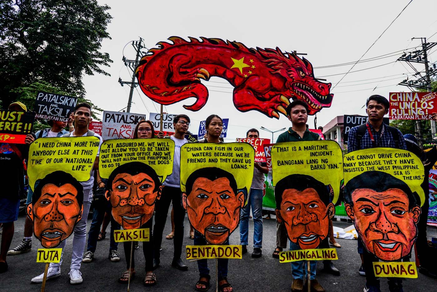 SYMBOL. Protesters hold image of a Chinese dragon and an image of President Rodrigo Duterte in a rally in Mendiola, Manila on July 12, 2019. Photo by Maria Tan/Rappler 