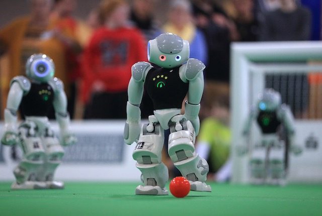 ROBOT AT PLAY. Robots of the category 'Standard Platform Liga' are in action during the RoboCup German Open 2015 in Magdeburg, Germany, April 24, 2015. Jens Wolf/EPA 