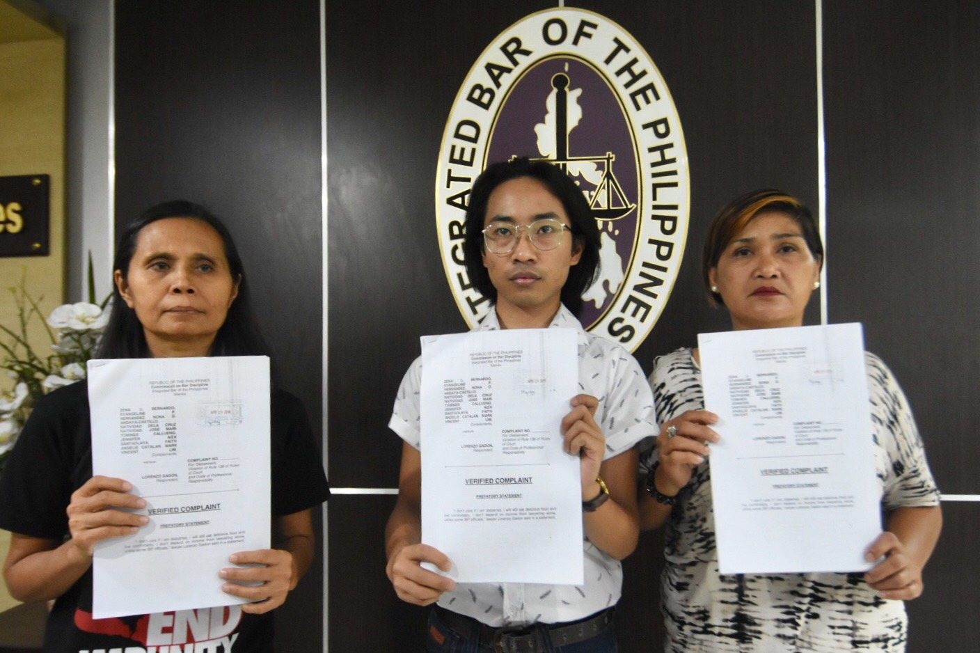 ANOTHER DISBARMENT COMPLAINT. (L-R) Nona Andaya-Castillo, Jose Mari Callueng, and Natividad dela Cruz Natividad hold up their group's disbarment complaint against Larry Gadon filed before the Integrated Bar of the Philippines. Photo by Angie de Silva/Rappler 