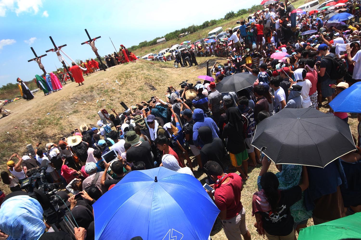 BLOOD, DEVOTION. Spectators gather to watch voluntary crucifixions in Barangay San Pedro Cutud, Pampanga. Photo by Darren Langit 