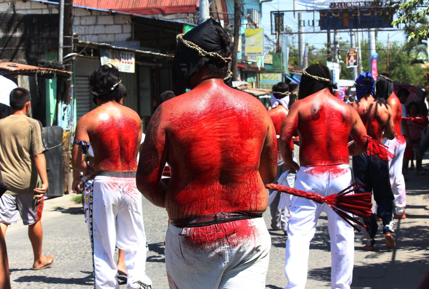 ATONEMENT. Devotees whips their body during a Good Friday ritual to atone for their sins. Photo by Darren Langit 