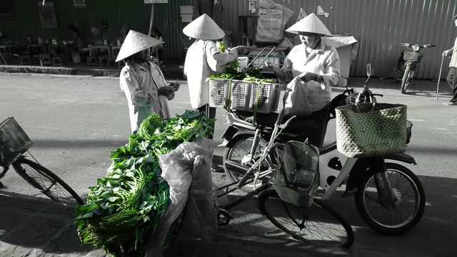 EARLY BIRDS. During early mornings, locals hit the streets to peddle produce and other items 
