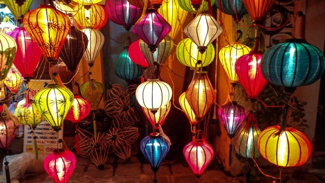 LIGHT ME UP. Colorful lanterns are lit at night outside some shops in Hoi An 