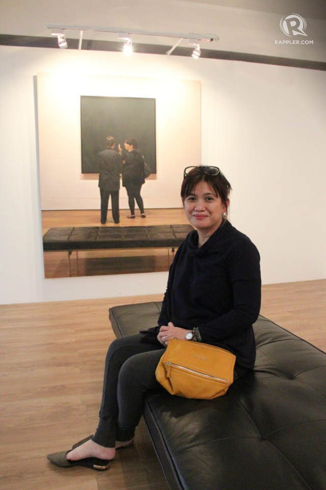 ‘MOMA, Black, White, Presence and Absence’ by Annie Cabigting, oil on canvas, Special Exhibits, with artist herself. Photo by Rome Jorge/Rappler 