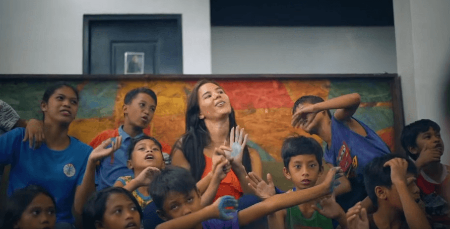 TIME WITH KIDS. Catriona and the kids of Young Focus in a scene from her music video "We're In This Together.' Screenshot from YouTube/Cat'elle    