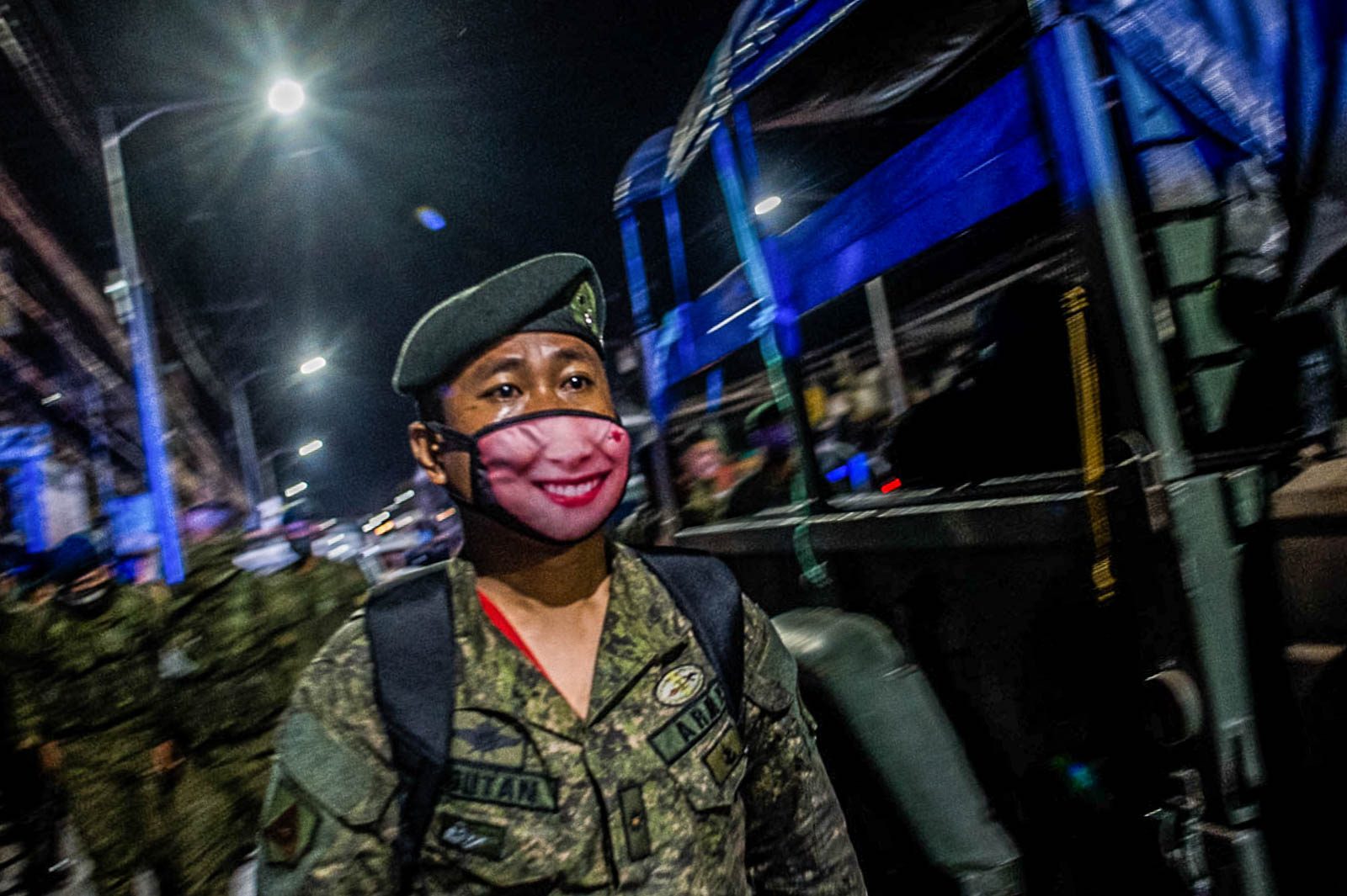 PROTECTIVE GEAR. A trooper from the AFP's Joint Task Force-NCR man the checkpoint in Valenzuela City. Photo by Lisa Marie David/Rappler 