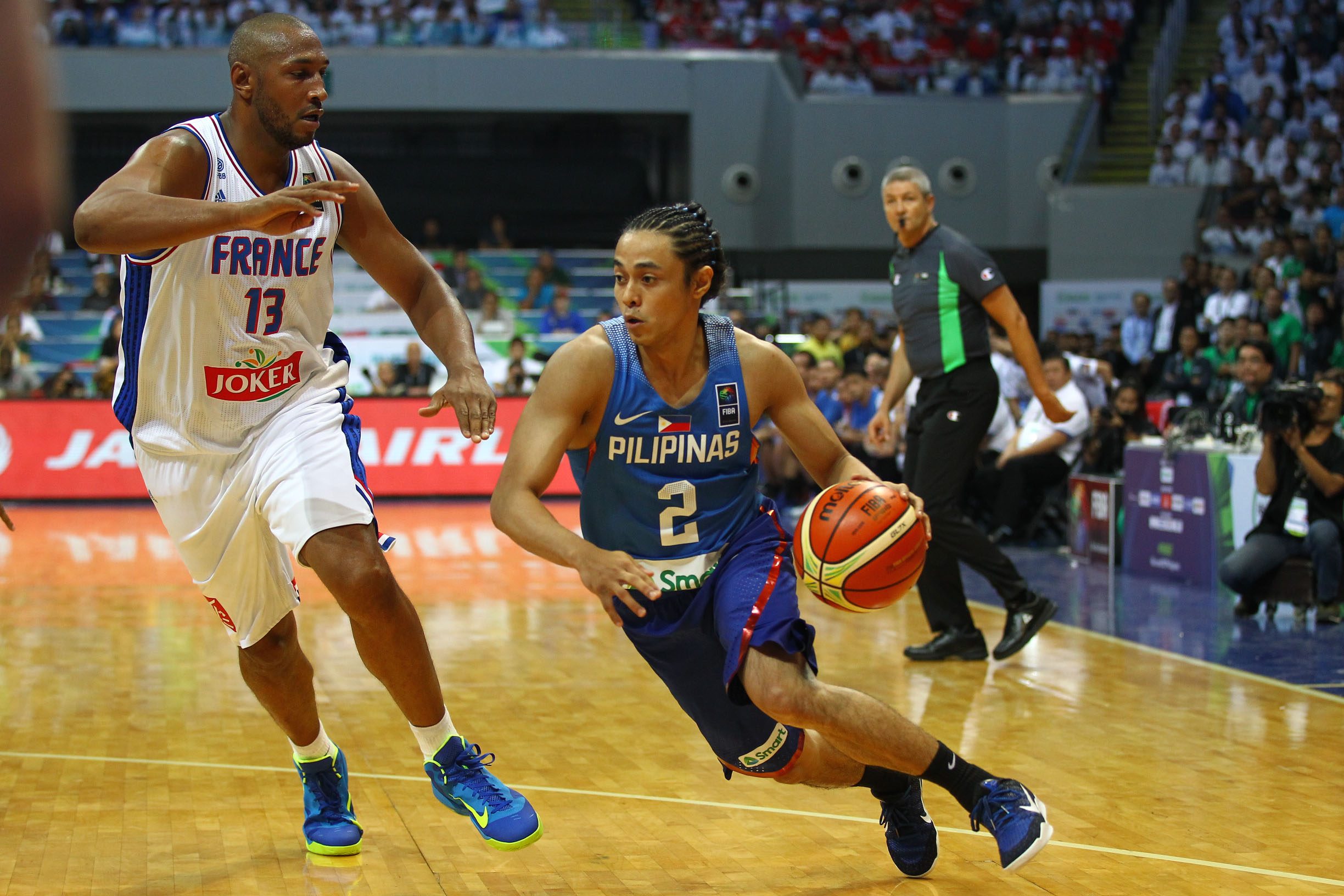Terrence Romeo uses his speed to get a step on Boris Diaw of France. 