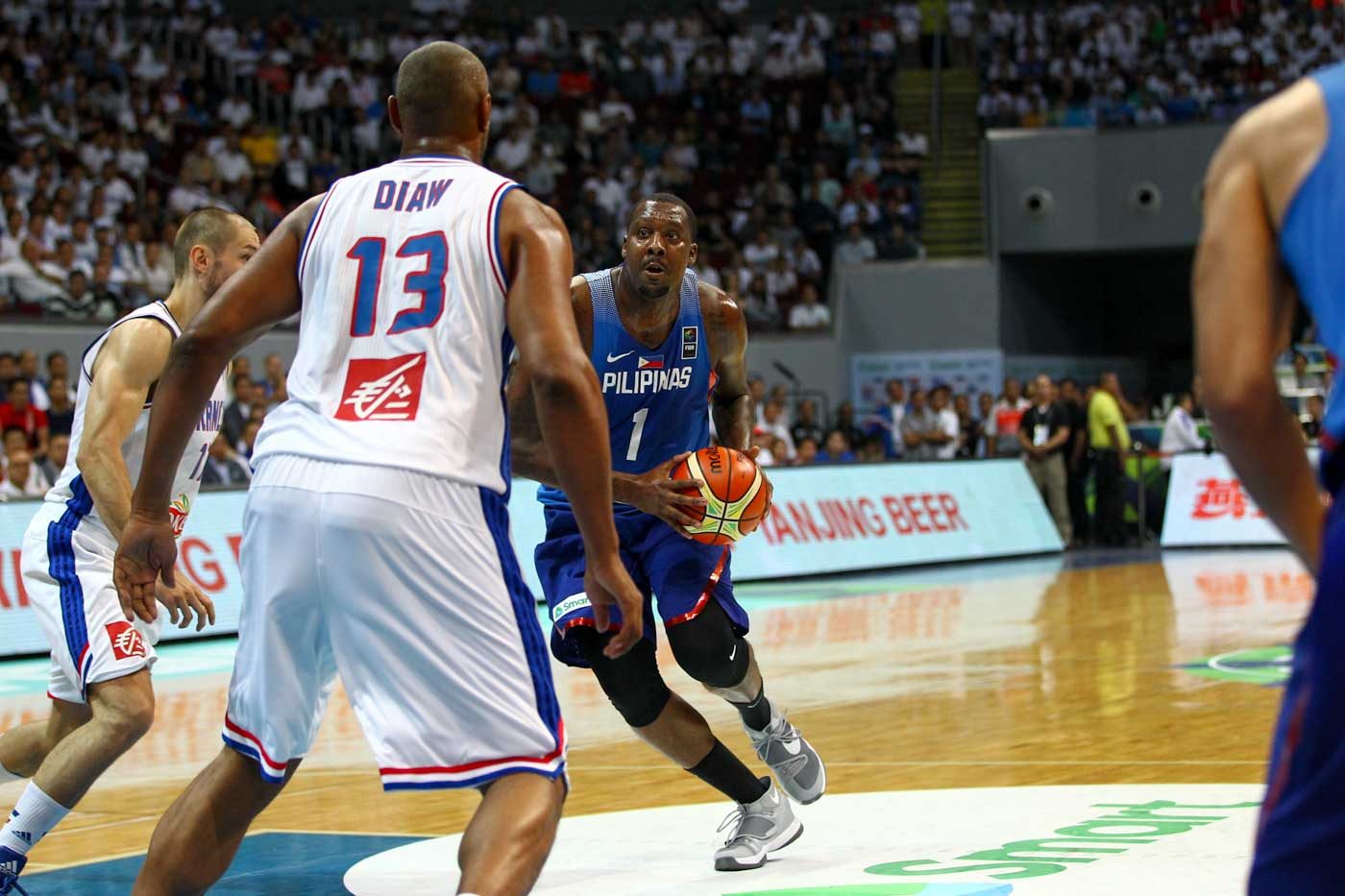 Andray Blatche of the Philippines drives to the rim against Boris Diaw of France. Photo by Josh Albelda/Rappler 