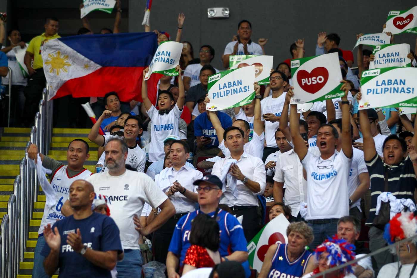 Filipino fans cheer on Gilas Pilipinas in their opening match of the FIBA Olympic Qualifying Tournament. Photo by Josh Albelda/Rappler 