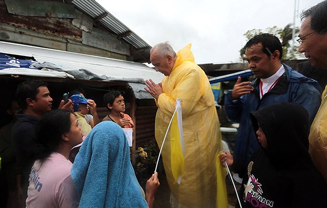Pope Francis visits families of typhoon Yolanda victims in one of the areas in Tacloban City Saturday, January 17, 2015. (Photo by Benhur Arcayan/Malacanang Photo Bureau)