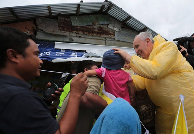 Pope Francis visits families of typhoon Yolanda victims in one of the areas in Palo, Leyte Saturday, January 17, 2015. (Photo by Benhur Arcayan/Malacanang Photo Bureau)