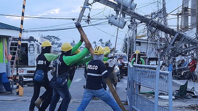 ROUND THE CLOCK. Linemen of Aklan Electric Cooperative (AKELCO) Task Force Kapatid-Ursula at work. Photo by AKELCO   