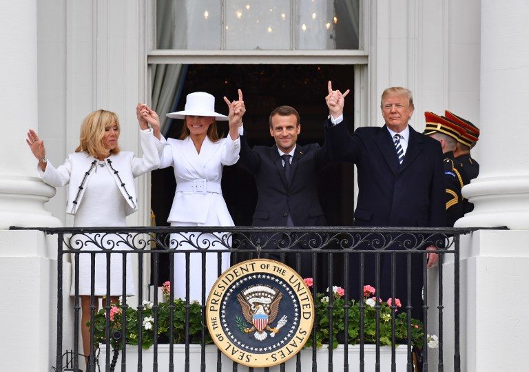 STATE VISIT. US President Donald Trump (R), French President Emmanuel Macron (2nd R), US First Lady Melania Trump (2nd L) and French First Lady Brigitte Macron are seen on the balcony at the White House in Washington, DC, on April 24, 2018. Photo by Nicholas Kamm/AFP  