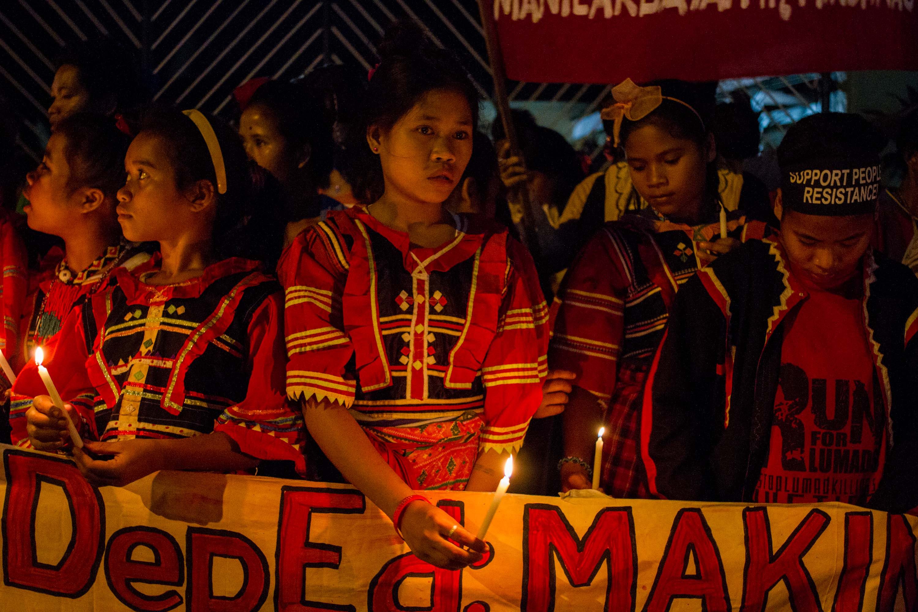 INDIGENOUS PEOPLES. Students of various tribal schools from Mindanao stage a protest rally and a candle lighting activity in front of the DEPED Main Office in Ortigas. Photo by Mark Saludes / Rappler  