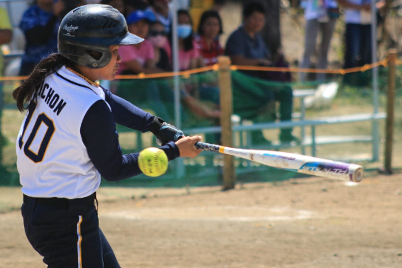 STRIKE. Aleona Pichon of NCR misses the ball in their Softball semifinals match against Central Luzon. Photo by Kenneth Duran/ Rappler  