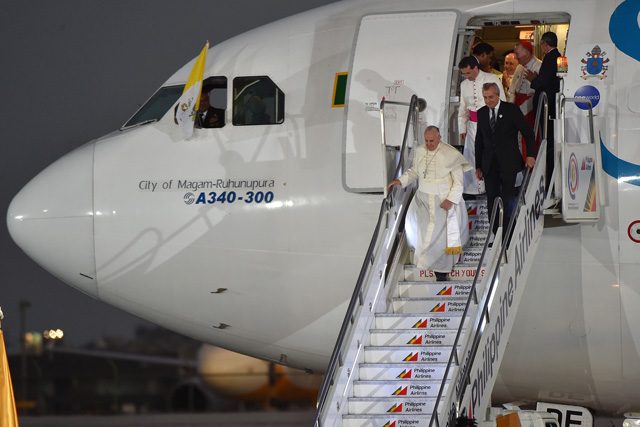Pope Francis as he disembarks from the plane on his arrival at the Villamor Air Base on January 15, 2015. Photo by Ettore Ferrari/EPA