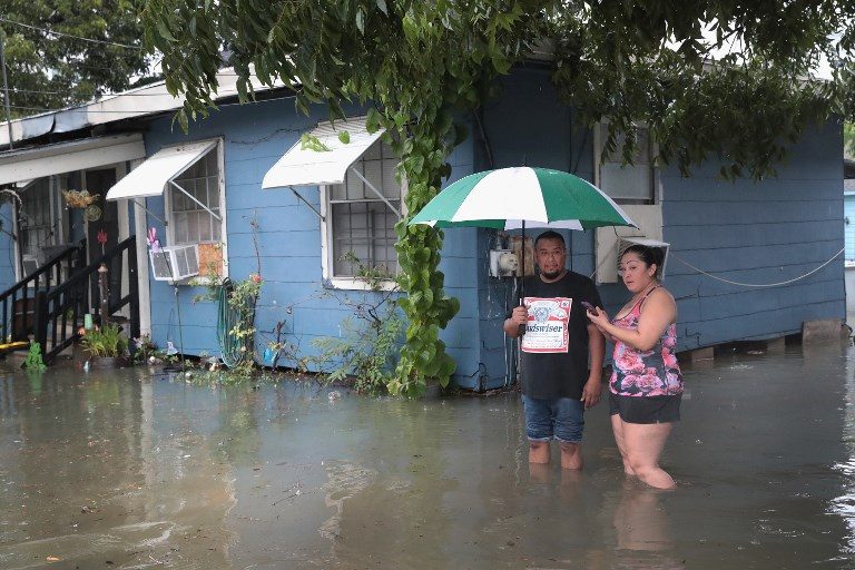 Houston battles floods due to Harvey, at least 3 dead