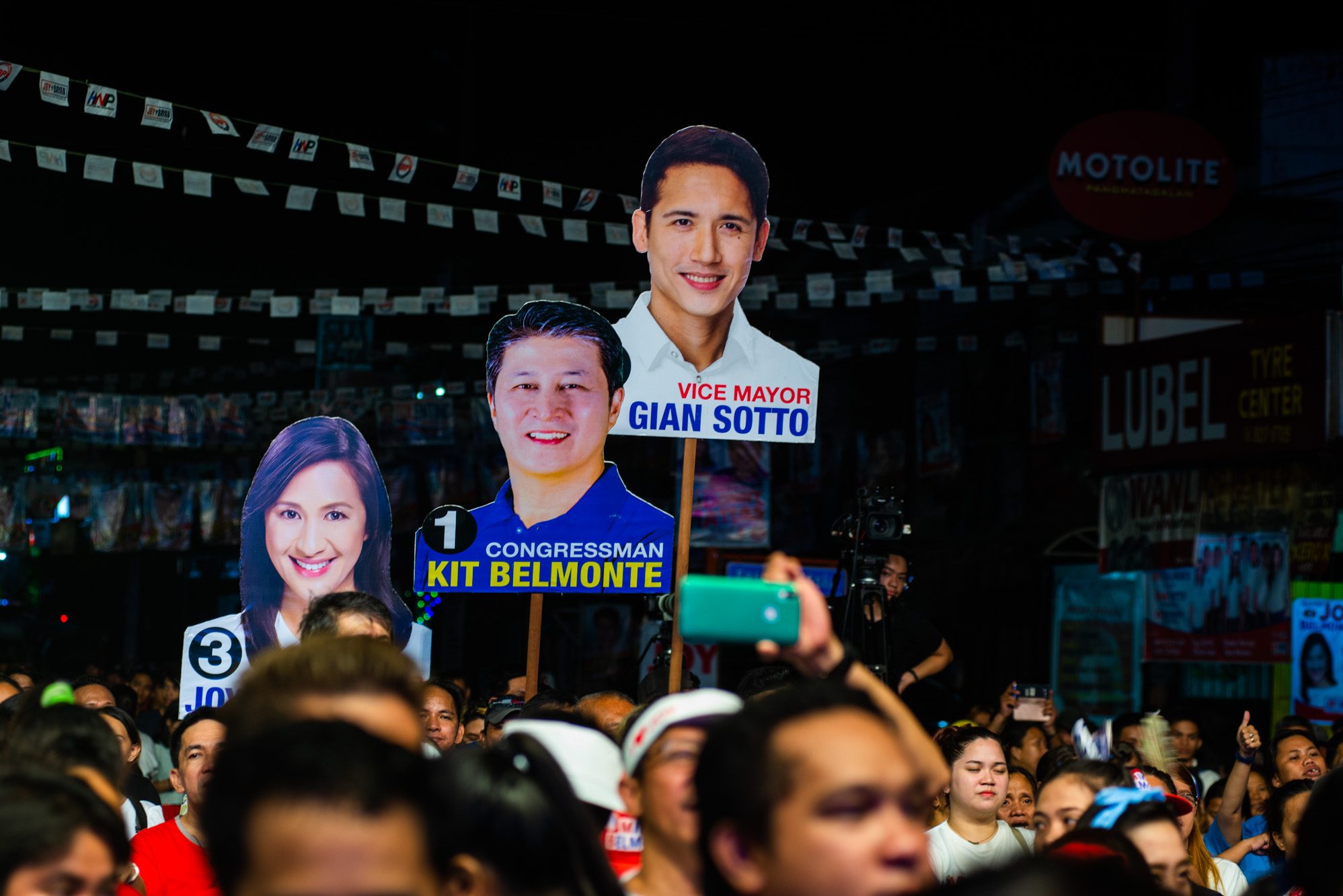 SBP. Supporters carry posters of Joy and Kit Belmonte and Gian Sotto during a campaign kick-off event in Tandang Sora. Photo by Maria Tan/Rappler  