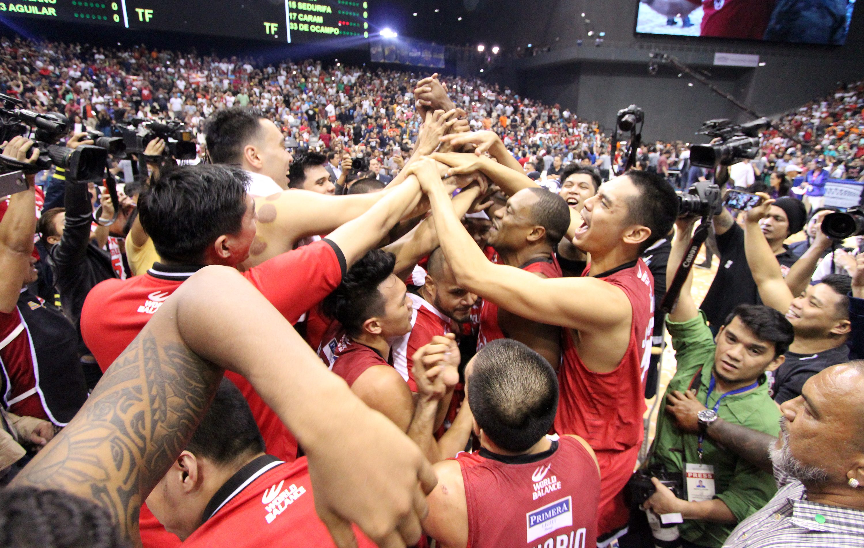 CHAMPS ANEW. Players of Barangay Ginebra Gin Kings celebrate on the floor after winning Game 7 of the PBA Governors Cup against the Meralco Bolts at the Philippine Arena in Bulacan on on October 27, 2017. Photo from PBA Images   