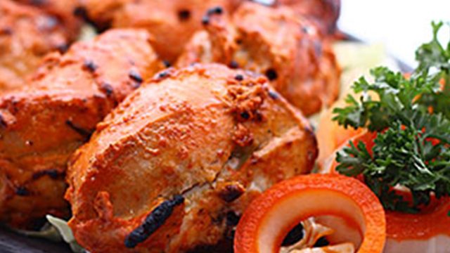 CHICKEN TANDOORI. Grilled chicken marinated with Indian spices. Photo courtesy of Queens at Bollywood's website    