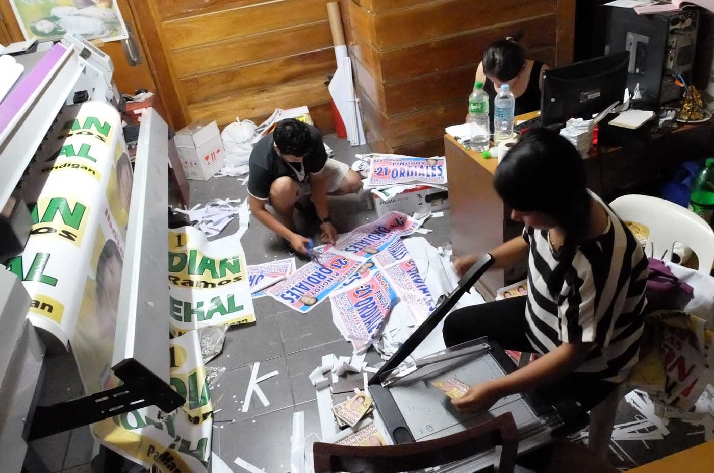 BUSY TIME. Workers at Franville Printshop in Nasugbu, Batangas rush production of election materials as the campaign period for local elective positions starts. Photo by Alecs Ongcal/Rappler  