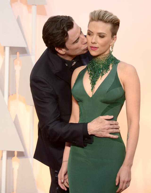 Scarlett Johansson says John Travolta’s red carpet kiss isn’t creepy