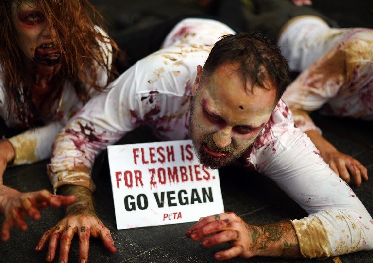 VEGAN ZOMBIES. Protestors dressed as zombies demonstrate in front of a KFC outlet in Sydney, Australia, on June 15, 2017. Photo by Saeed Khan/AFP   