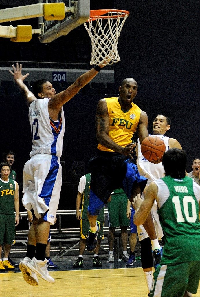 UAAP MOMENT. Kobe Bryant wears the FEU Tamaraws jersey during an exhibition game with Filipino collegiate and pro basketball stars on July 13, 2011. Photo by Jay Directo/ AFP  