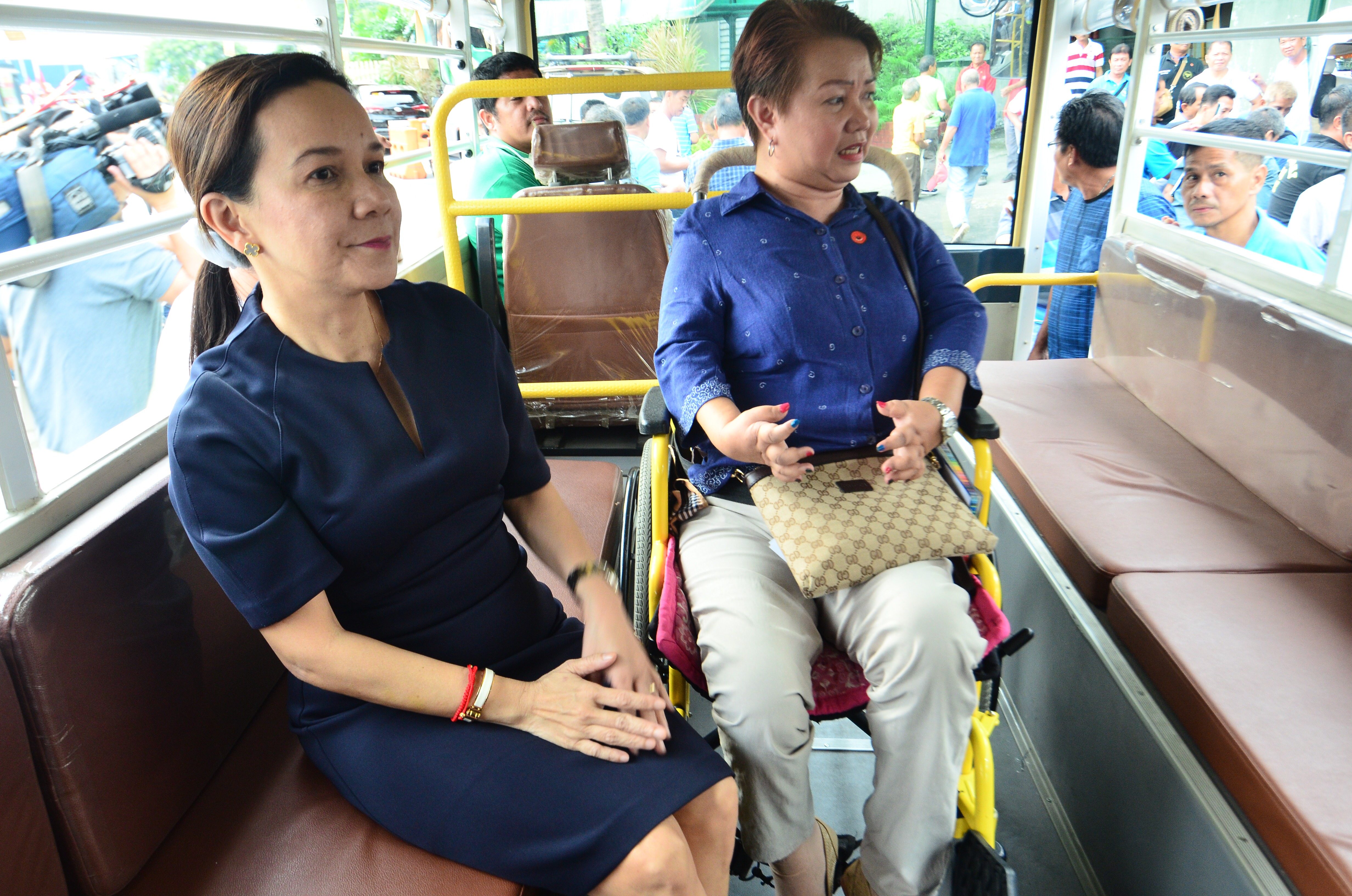 INSPECTION. Senator Grace Poe and Miss Lalaine Guanson of the Wheelchair Friendly Solution, Inc. answer questions to journalists while sitting inside an electric jeepney. Photo by Angie de Silva/Rappler 