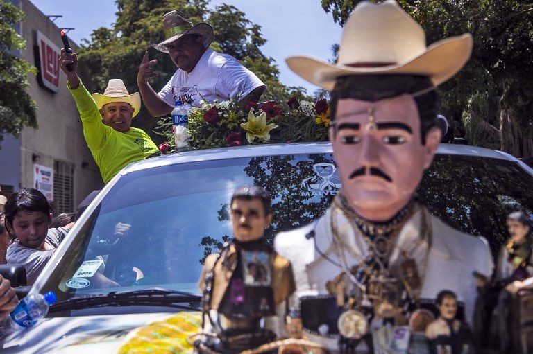 NARCO SAINT. Believers take part in the celebration of the 109 anniversary of narco-saint Jesus Malverde's birth in Culiacan, State of Sinaloa, Mexico on May 3, 2018. Photo by Rashide Frias/AFP  