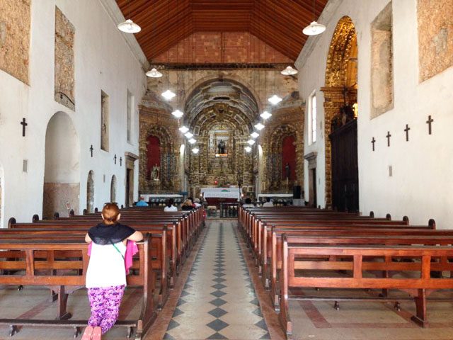 QUIET MOMENT. Mama visits a church in Rio de Janeiro 