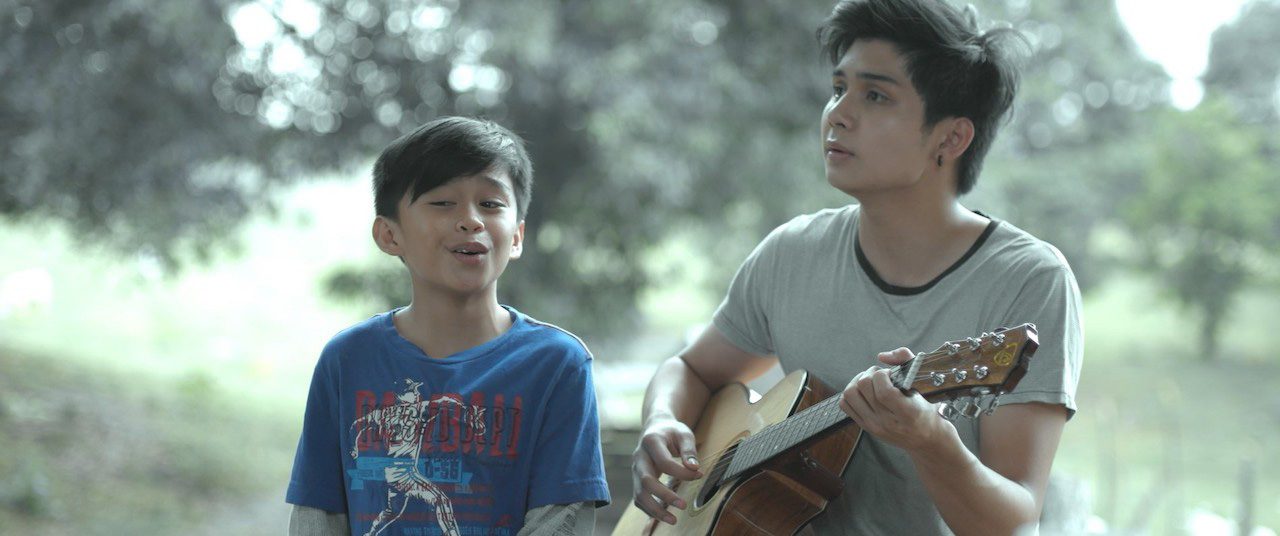 MUSIC. Ryle Paolo Santiago and Mackie Empuerto in a scene from the movie.  