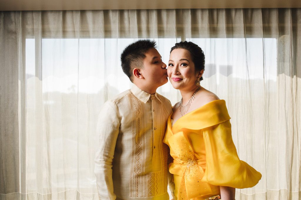  KISS FOR LUCK. Bimb gives his mother a kiss before they head to the 'Crazy Rich Asians' event.