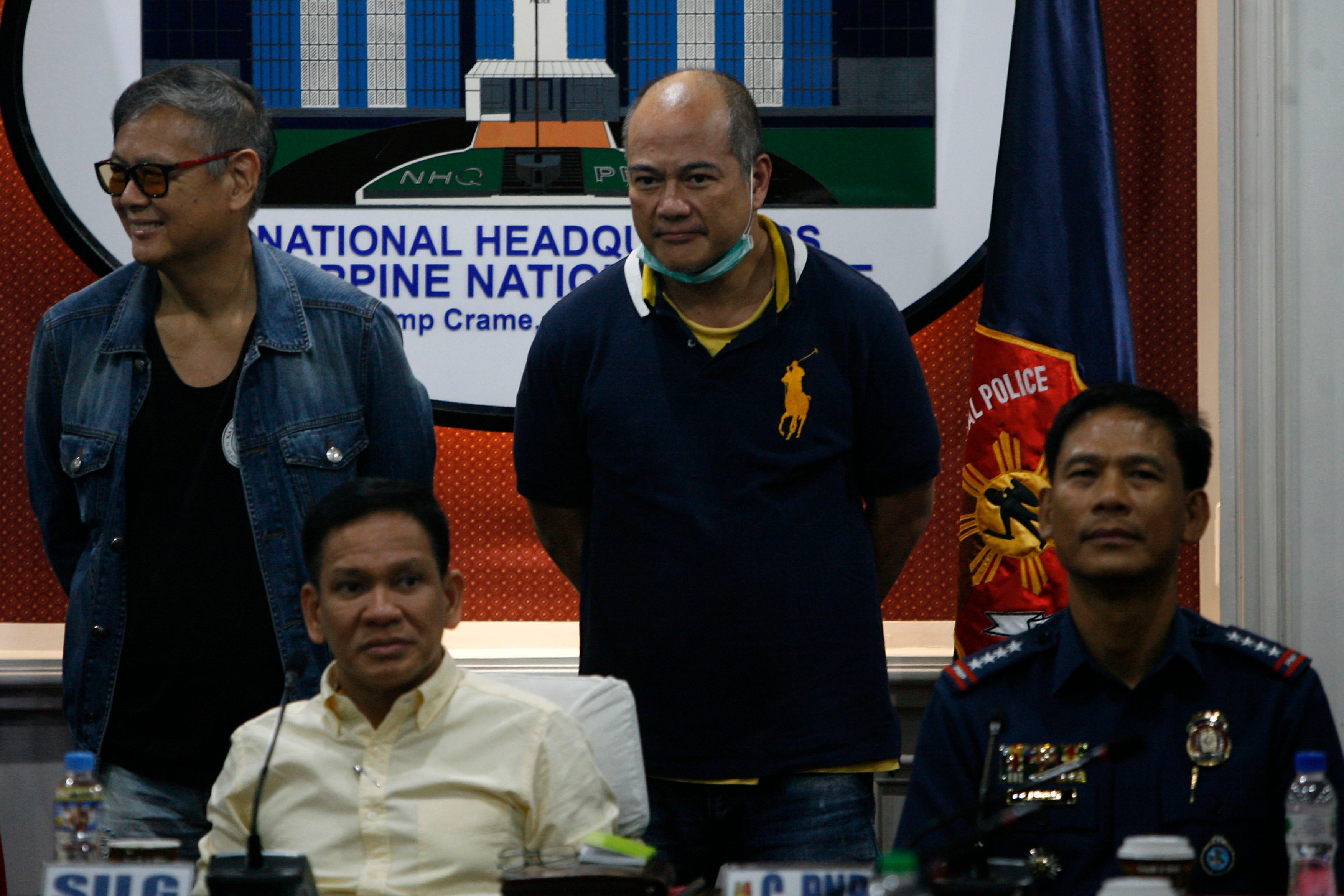 CRAME. Joel and Mario Reyes, suspects in the murder of broadcaster Gerry Ortega, are presented at Camp Crame by Interior Secretary Mel Sarmiento and PNP chief Director General Ricardo Marquez on Sept 25. Photo by Ben Nabong/Rappler 